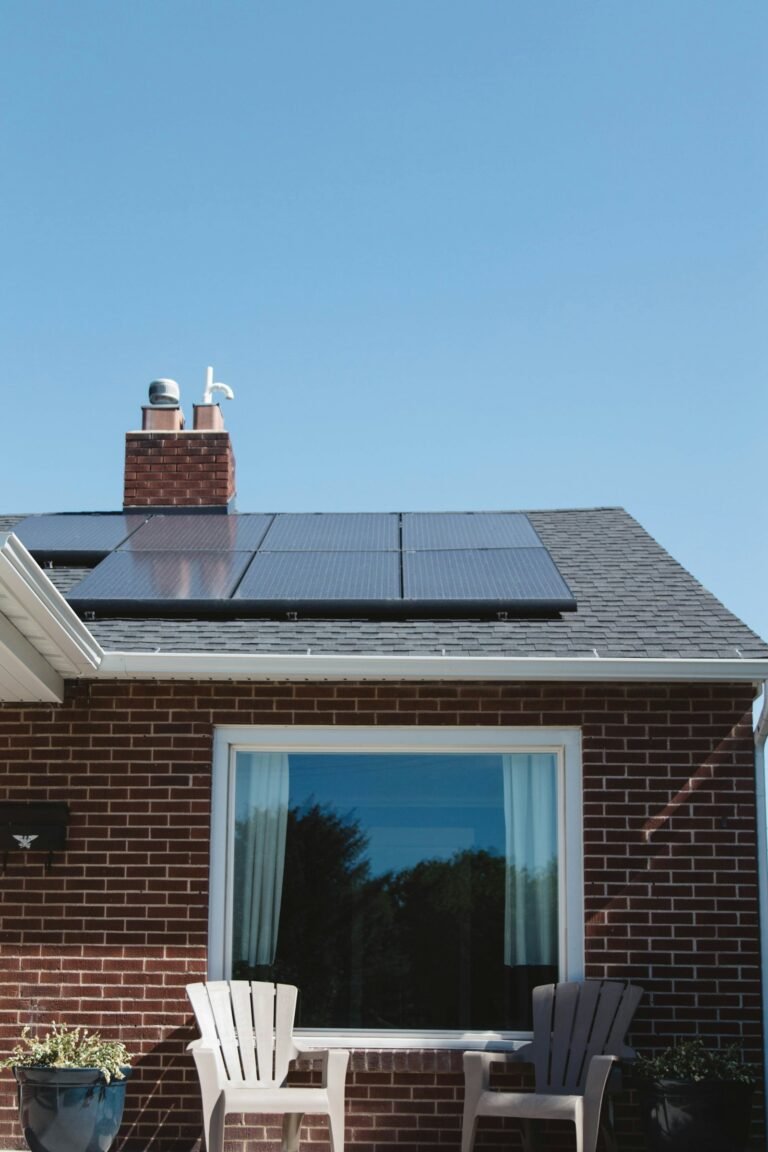 Brick family home with a neatly installed solar panel array on the pitched roof