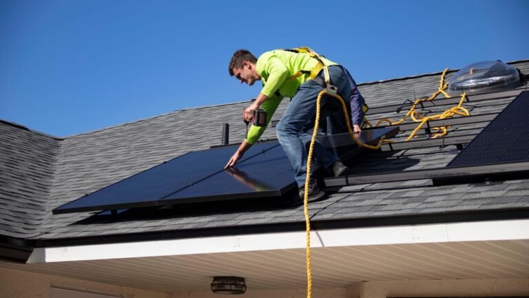 Solar technician working on a residential rooftop installation